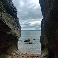 Buy canvas prints of Sea through the rocks.  by Rachel Goodfellow