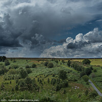 Buy canvas prints of Stormy Roman Road Through Yorkshire Moors by Ron Ella