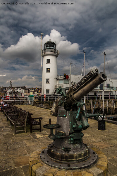 Scarborough Harbour Lighthouse and Gun Picture Board by Ron Ella