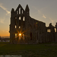 Buy canvas prints of Radiant Whitby Abbey at Sunset by Ron Ella