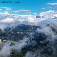 Buy canvas prints of Clouds Lift to Reveal Banff's Majesty by Ron Ella