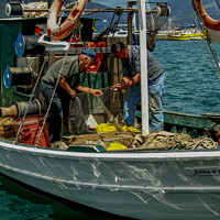 Buy canvas prints of Mending Nets at Sea by Ron Ella