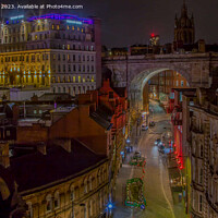 Buy canvas prints of Nighttime Splendor: Newcastle's Tyne Bridge View by Ron Ella