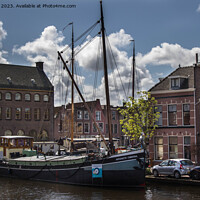 Buy canvas prints of Navigating Leiden's Historic Harbor by Ron Ella