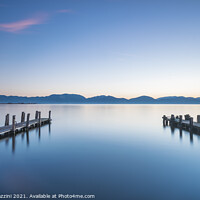 Buy canvas prints of Two Wooden piers on a lake by Stefano Orazzini