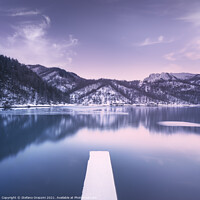 Buy canvas prints of Gramolazzo iced lake and snowy pier in Apuan mountains. Italy by Stefano Orazzini