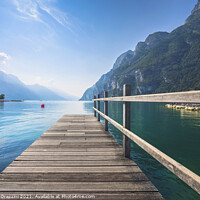 Buy canvas prints of Wooden pier on the lake. Riva del Garda, Italy by Stefano Orazzini