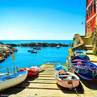 Buy canvas prints of Riomaggiore village, boats and sea. Cinque Terre, Italy, by Stefano Orazzini
