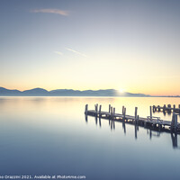 Buy canvas prints of Three Wooden piers at sunrise. Torre del Lago Puccini. by Stefano Orazzini
