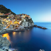 Buy canvas prints of Manarola village, rocks and sea at sunset. Cinque Terre, Italy by Stefano Orazzini