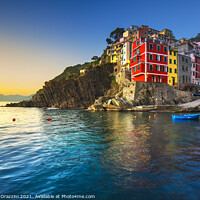 Buy canvas prints of Riomaggiore town and sea at sunset. Cinque Terre by Stefano Orazzini