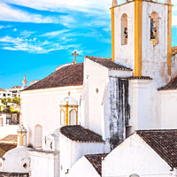 Buy canvas prints of Church and white facades in Tavira, Portugal by Stefano Orazzini