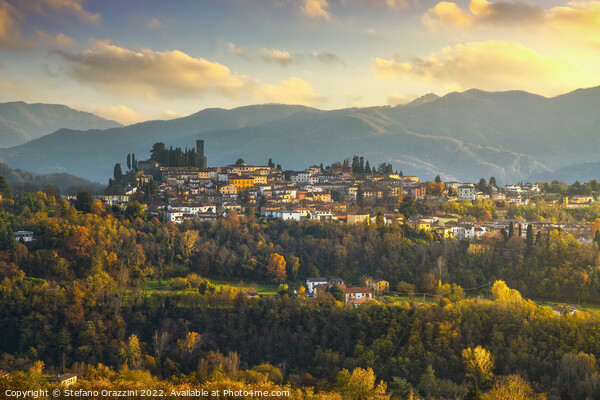 Barga village at sunset in autumn. Garfagnana, Tuscany, Italy. Framed Mounted Print by Stefano Orazzini