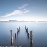 Buy canvas prints of Wooden pier remains at sunrise. Massaciuccoli lake. by Stefano Orazzini