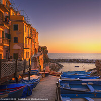 Buy canvas prints of Riomaggiore boats in the street at sunset. Cinque Terre by Stefano Orazzini