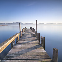 Buy canvas prints of Wooden jetty and lake at sunrise. Torre del Lago Puccini by Stefano Orazzini