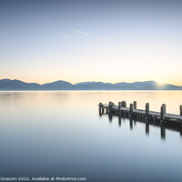 Buy canvas prints of Wooden pier at sunrise. Lake Massaciuccoli by Stefano Orazzini
