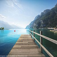 Buy canvas prints of Wooden pier on the lake. Riva del Garda, Italy by Stefano Orazzini