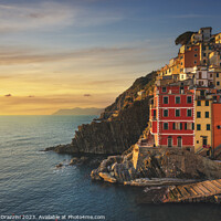 Buy canvas prints of Wonderful sunset over Riomaggiore fishing village. Cinque Terre by Stefano Orazzini
