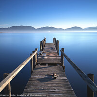 Buy canvas prints of Wooden pier at sunrise. Lake Massaciuccoli, Tuscany, Italy by Stefano Orazzini