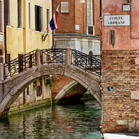 Buy canvas prints of Calm Quiet Canal in Venice Italy by John Gilham