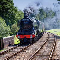 Buy canvas prints of The Flying Scotsman 60103 Steam Locomotive under steam on its approach to Kingscote station West Sussex on a visit to The Bluebell Railway  by John Gilham