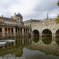Buy canvas prints of Pulteney Bridge and the weir on the river Avon in Bath Somerset England UK by John Gilham