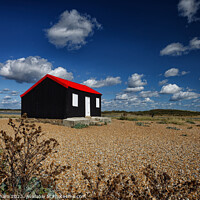 Buy canvas prints of A Red Roofed Corrugated Iron Hut on the shingle at by John Gilham