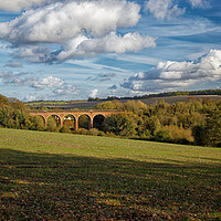 Buy canvas prints of Outdoor field with a rail viaduct in the Darent va by John Gilham