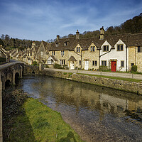 Buy canvas prints of The bridge over the river in the picturesque village of Castle Combe in the Cotswolds Wiltshire UK by John Gilham
