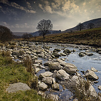 Buy canvas prints of Rocky shallow stream in Wales UK by John Gilham