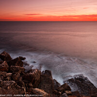 Buy canvas prints of Serene Sunset over Rocky Horizon by Dudley Wood