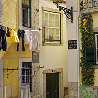 Buy canvas prints of Alfama back street  by Dudley Wood