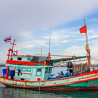 Buy canvas prints of  a fishing boat at a Pier in Thailand Southeast Asia by Wilfried Strang