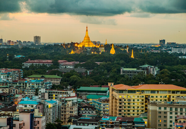 View from a rooftop bar of the Sakura Tower in Yangon Myanmar to the Shwedagon Pagoda Picture Board by Wilfried Strang