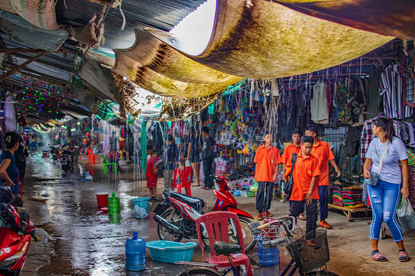 When the big Rain comes to the Chongchom Market in Surin somewhere in Isan Thailand Picture Board by Wilfried Strang