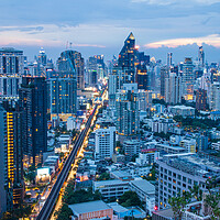 Buy canvas prints of The Cityscape, the Railway of the Skytrain and the skyscraper of Bangkok in Thailand Southeast Asia at the Evening by Wilfried Strang