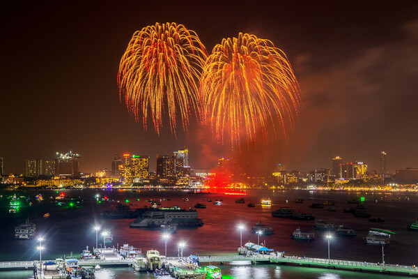 fantastic and colorful fireworks display over the night sky of the city during a festival Picture Board by Wilfried Strang