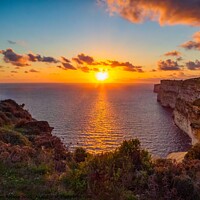 Buy canvas prints of Picturesque Sunset with surrounding cliffs of the  by Maggie Bajada