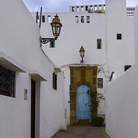 Buy canvas prints of White Building with Blue Door in Rabat, Morocco. by Maggie Bajada