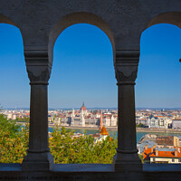 Buy canvas prints of Framed Arch with view of Danube River and Budapest, Hungary. by Maggie Bajada