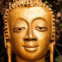 Buy canvas prints of Buddist sculpture in Luang Prabang, Laos by Ian Miller