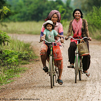 Buy canvas prints of Women and Child on Bikes, Asia by Ian Miller