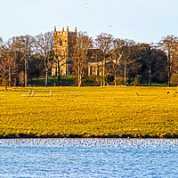 Buy canvas prints of St Withburga's Church and Holkham Lake by GJS Photography Artist