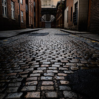 Buy canvas prints of wet cobbled street in Manchester city center UK by Paul Gorvett