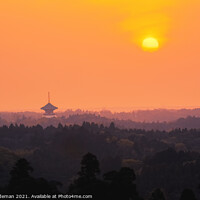 Buy canvas prints of Sunrise over a Bhuddist Temple in Japan by Geoff Tydeman