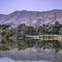 Buy canvas prints of Reflection of trees and hills in the water by Lucas D'Souza