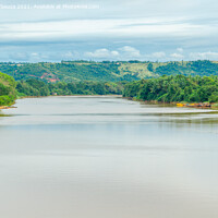 Buy canvas prints of River with hills and clouds in the background by Lucas D'Souza