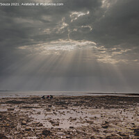 Buy canvas prints of Sunrays through a gap in the overcast sky with black clouds with by Lucas D'Souza