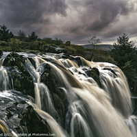 Buy canvas prints of A large waterfall at Sunset by Ivor Bond